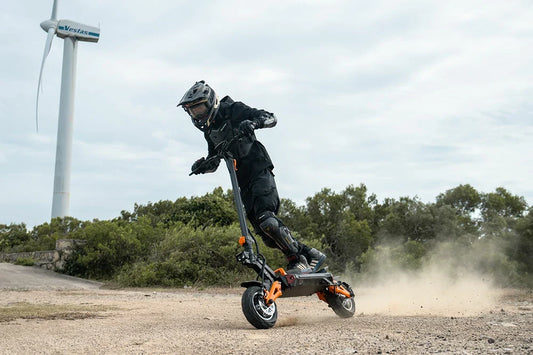 FREEBOY H9 dual-motor electric scooter riding on gravel trail