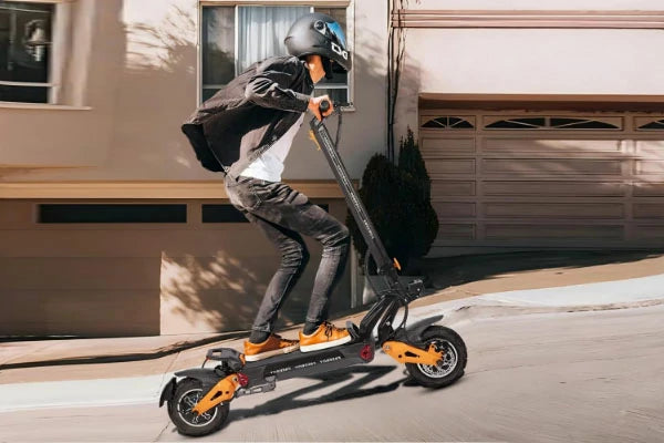 FREEBOY commuter electric scooter rider cruising on urban pavement road