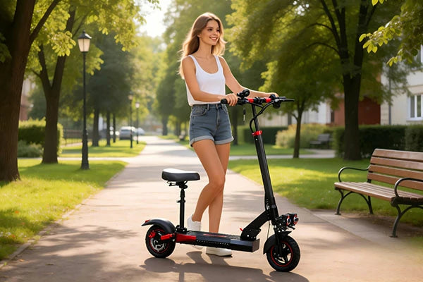 FREEBOY electric scooter woman riding through scenic roadside greenery