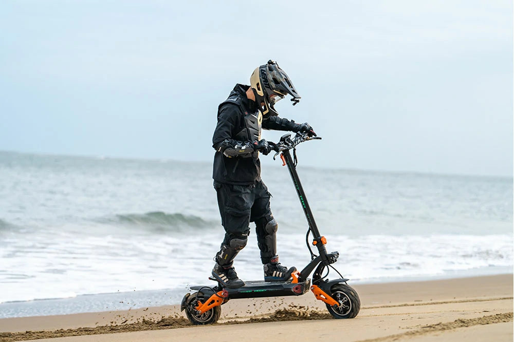 FREEBOY H9 lightweight scooter rider slow riding along beach pavement